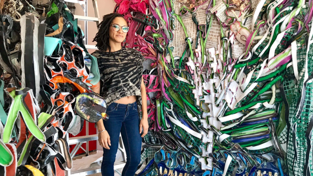 Artist Alicia Piller surrounded by her exhibition works