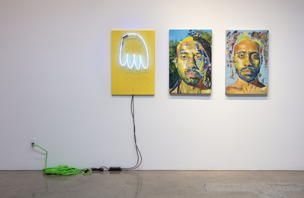 Three works by Yung Jake: a ghost-shaped lighting fixture, and two colorful self portraits